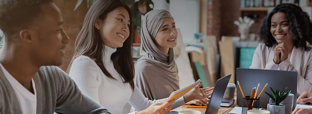 Multicultural People sitting at a table having a meeting