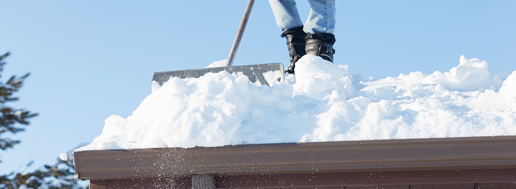 Person shoveling roof